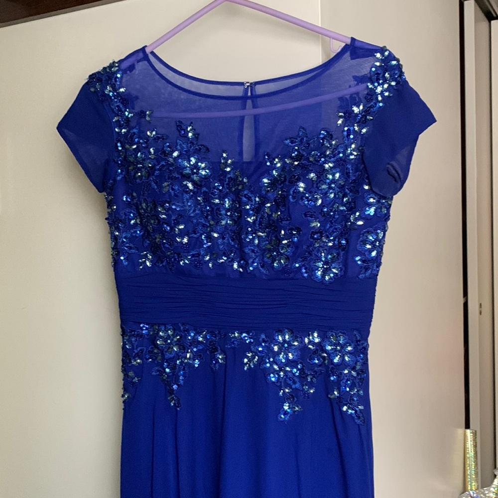 Blue beaded dress with somewhat of a floral pattern